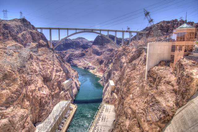 Soaring nearly 900 ft above the Colorado River, the Hoover Dam Bypass features a 1,900-ft-long arched concrete bridge.