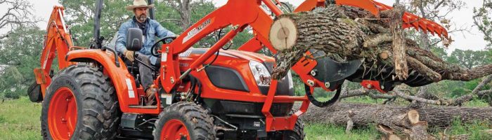Kioti tractor with grapple attachment