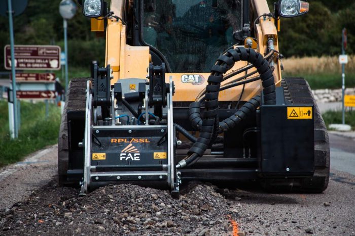 FAE road planer cold planer on a compact track loader closeup