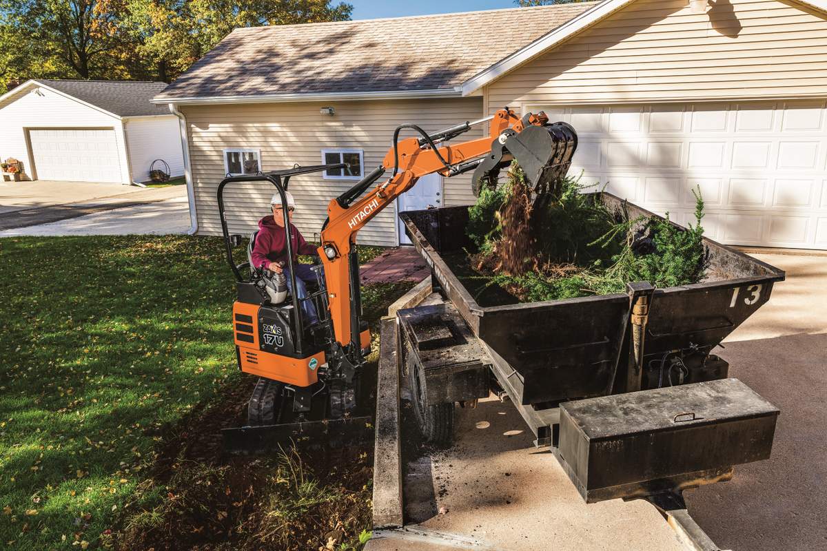 Hitachi-ZX17U_3 mini excavator working around a house home