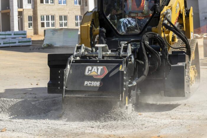 Caterpillar PC306 cold planer on a Cat skid steer