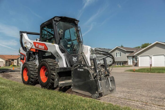 Bobcat S76 skid steer with a cold planer attachment