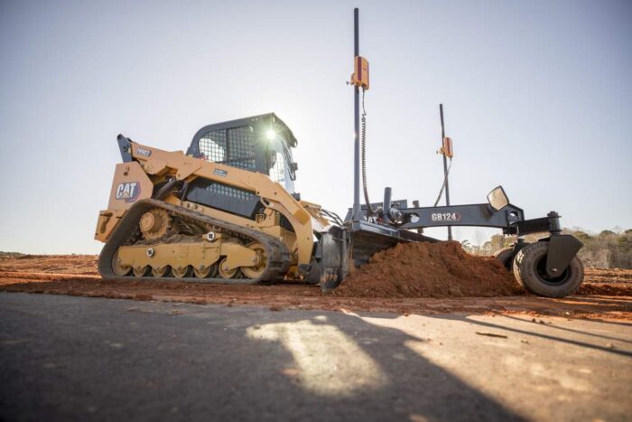 Caterpillar compact track loader with a Smart Grade attachment