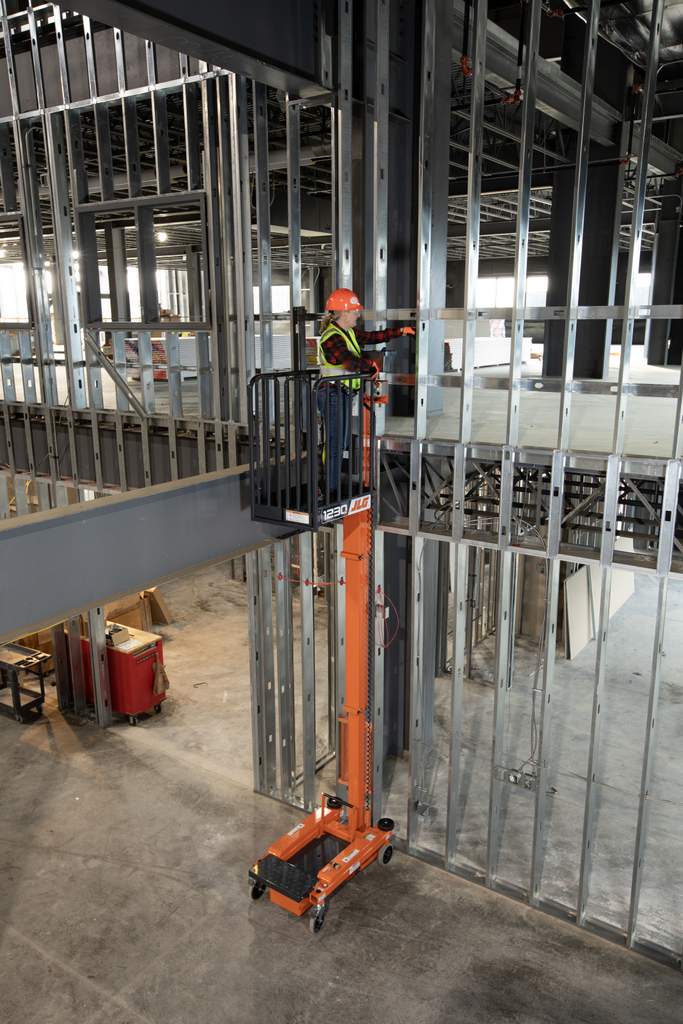 JLG 1230P low level access lift reaching up with worker
