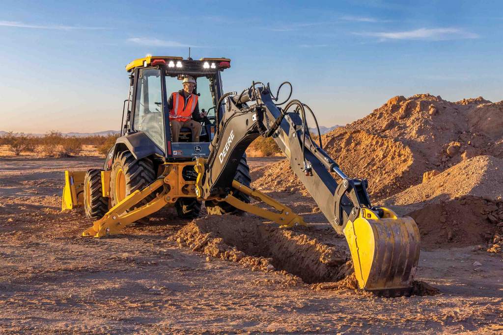 John Deere 20 P-Tier Backhoe working in the dirt