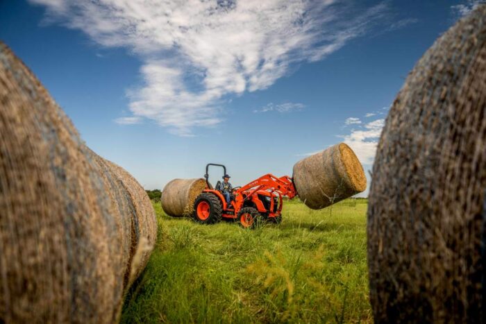 Kubota MX4900 tractor with a bale spear and hay