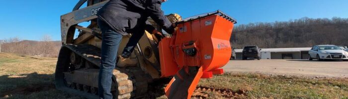 EZG Mobile Mixer on a compact track loader with a worker