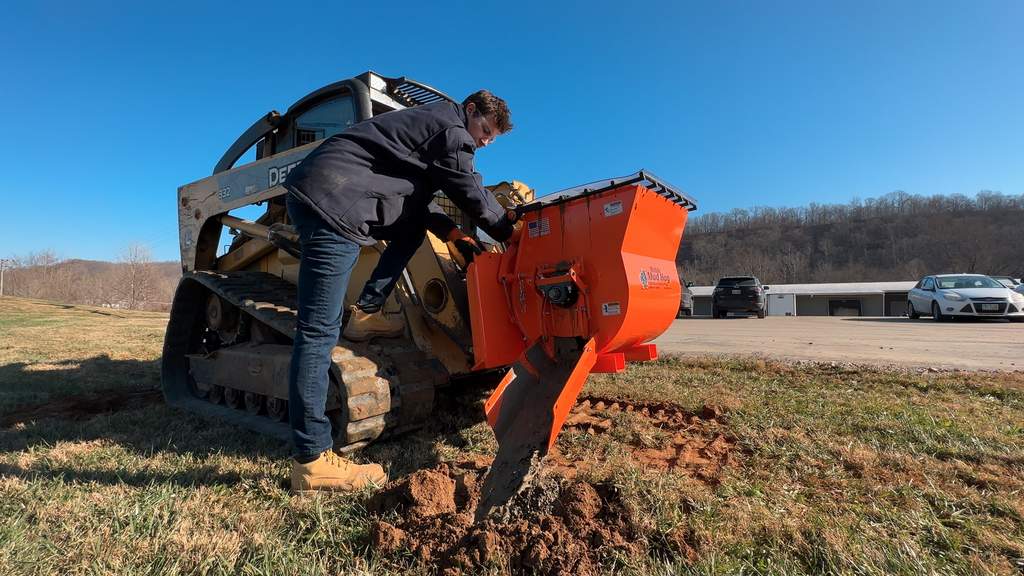 EZG Mobile Mixer on a compact track loader with a worker