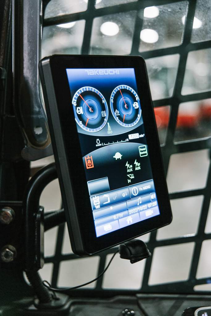 Takeuchi TL11R3 compact track loader inside cab with touchscreen monitor