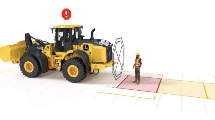 John Deere Smart Detect technology shown with a wheel loader and a worker