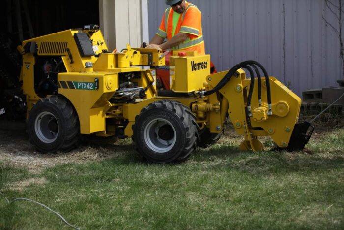 Vermeer PTX42 trencher using a vibratory plow attachment