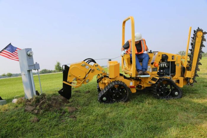 Vermeer PTX44 trencher using a vibratory plow attachment