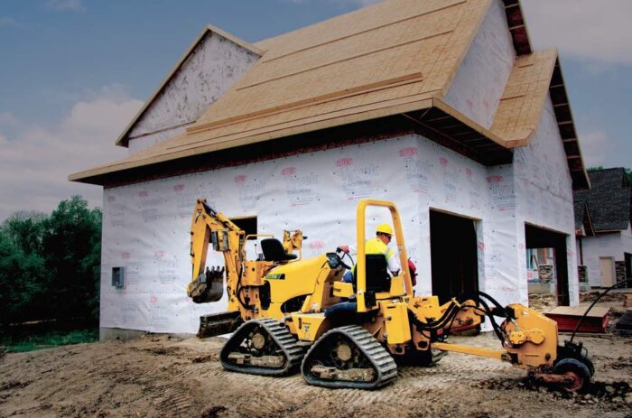Vermeer RTX750 trencher using a vibratory plow attachment