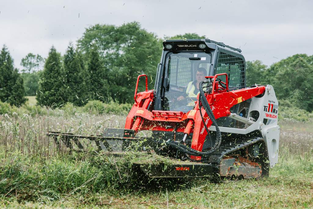 Takeuchi TL11R3 compact track loader cutting grass