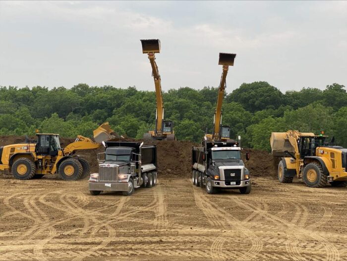 Caterpillar Construction and Technology Days lots of equipment in the field