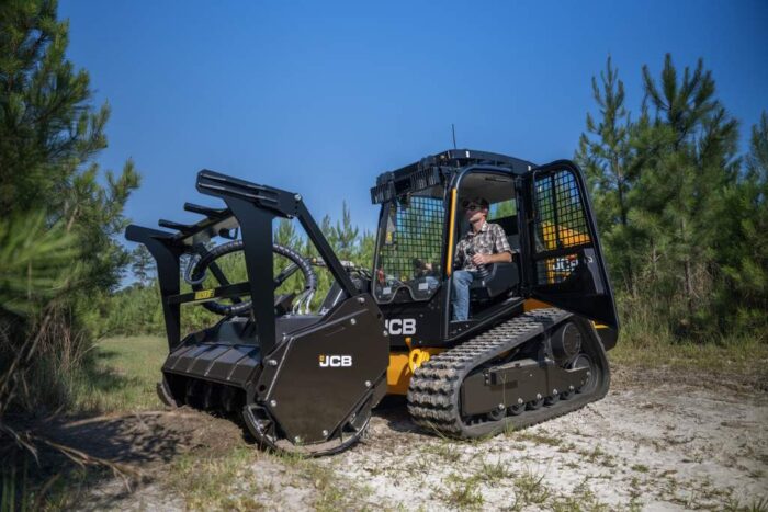 JCB 400T compact track loader with brush cutter attachment and door open 