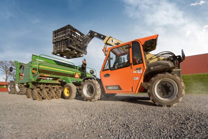 JLG telehandler on a farm lifting 
