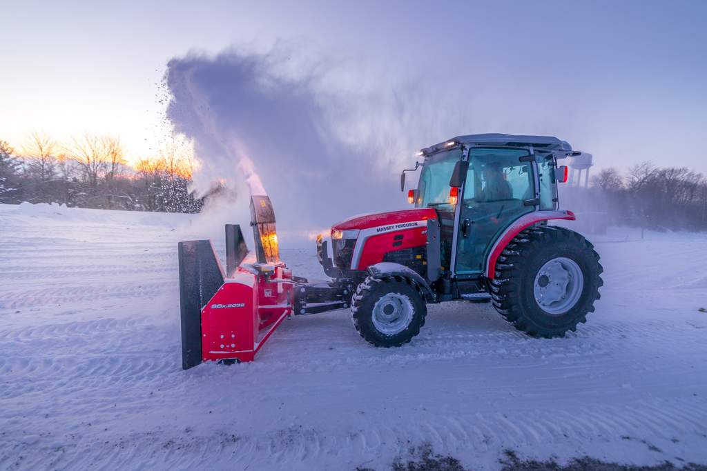 Massey Ferguson MF25 tractor in the snow with a snow thrower
