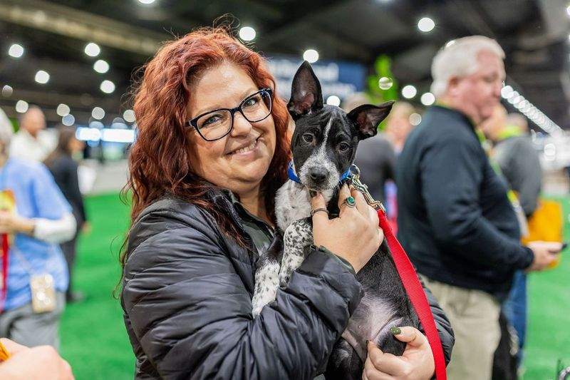 Equip Expo woman adopts dog Mutt Madness 2024