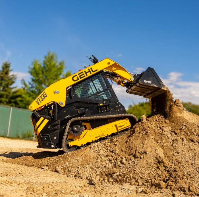 GEHL_VT335_CTL dumping dirt into a pile