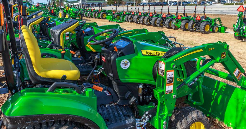 John Deere tractors of various sizes with a variety of attachments with homeowner tasks, construction, snow removal, and transporting materials.