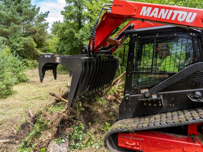 Manitou_CTL_Grapple compact track loader dumping brush 