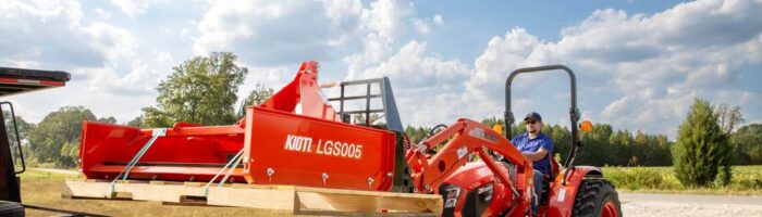 Kioti DK20 compact tractor with a landplane attachment on a truck