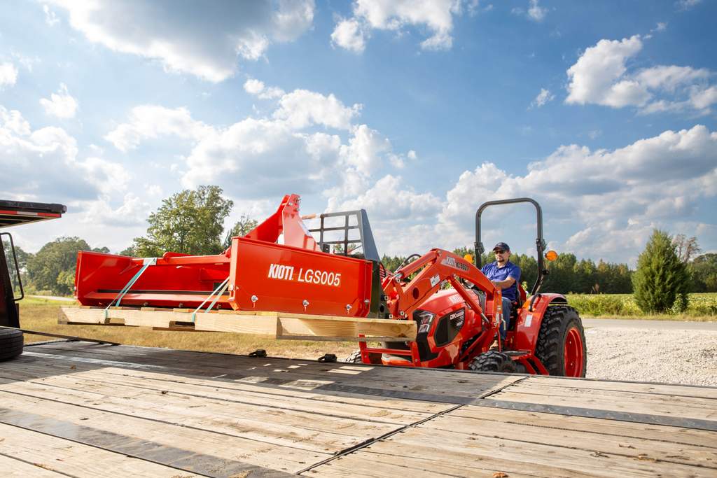 Kioti DK20 compact tractor with a landplane attachment on a truck
