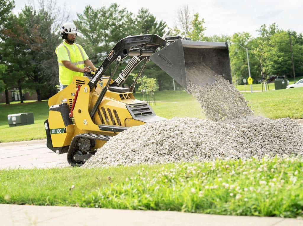 Vermeer ML100 mini loader dumping gravel