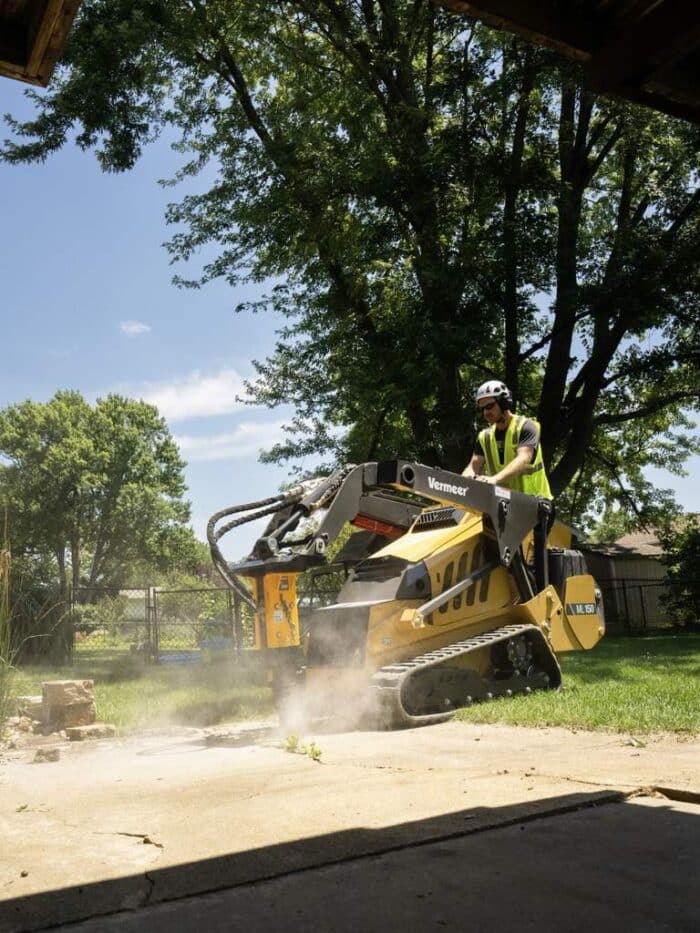 Vermeer ML150 mini loader using a breaker attachment