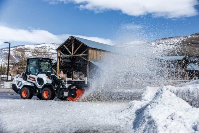 bobcat-l35-small-articulated-loader-angle-broom in the snow