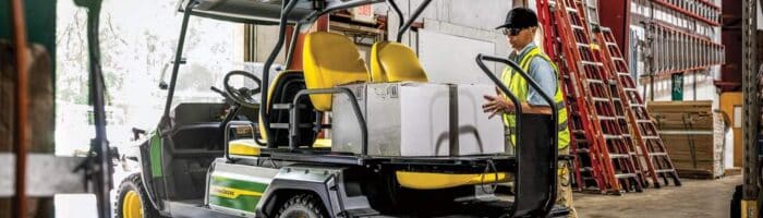 John Deere Gator GX Electric utility vehicle in a warehouse