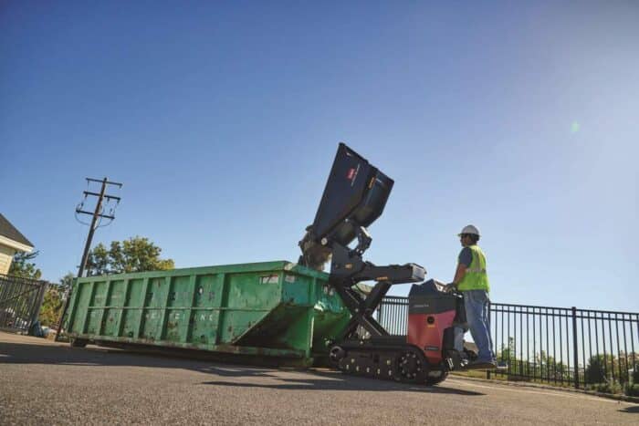 Toro Ultra Buggy e2500-THL lifting into a dumpster