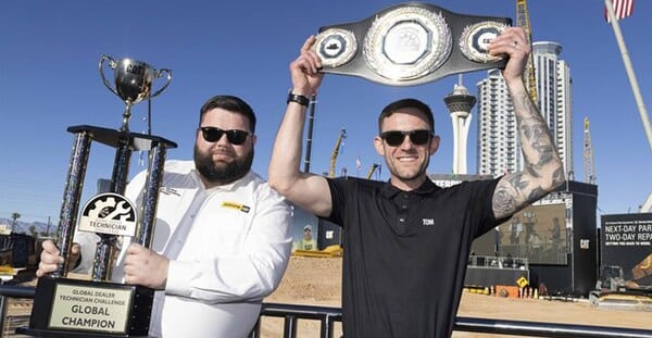 Tom March (right) from England won the inaugural Caterpillar Global Dealer Technician Challenge.