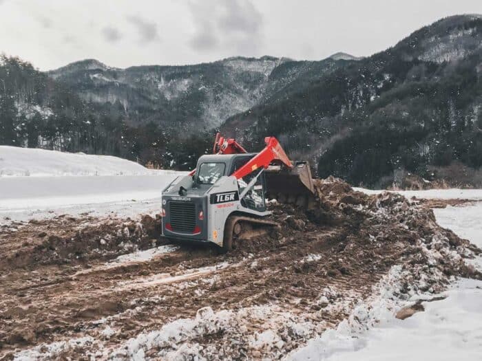 Takeuchi compact track loader in snow