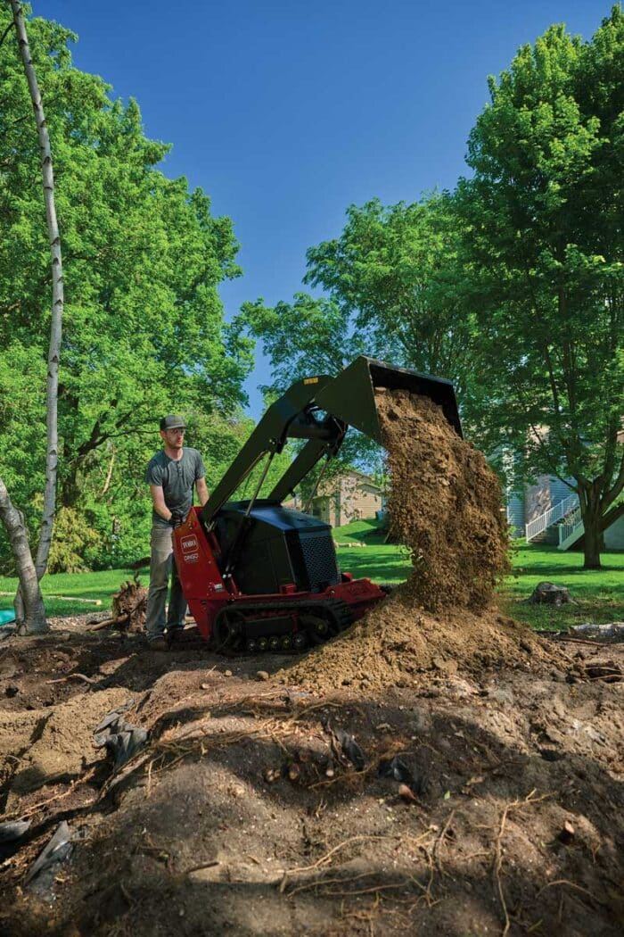 Toro Dingo dumping dirt